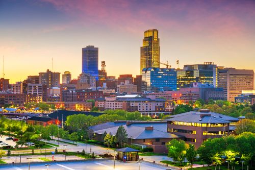 Omaha skyline and Nebraska real estate market with housing activity across nearby suburban communities